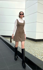 a lady in a Khaki dress